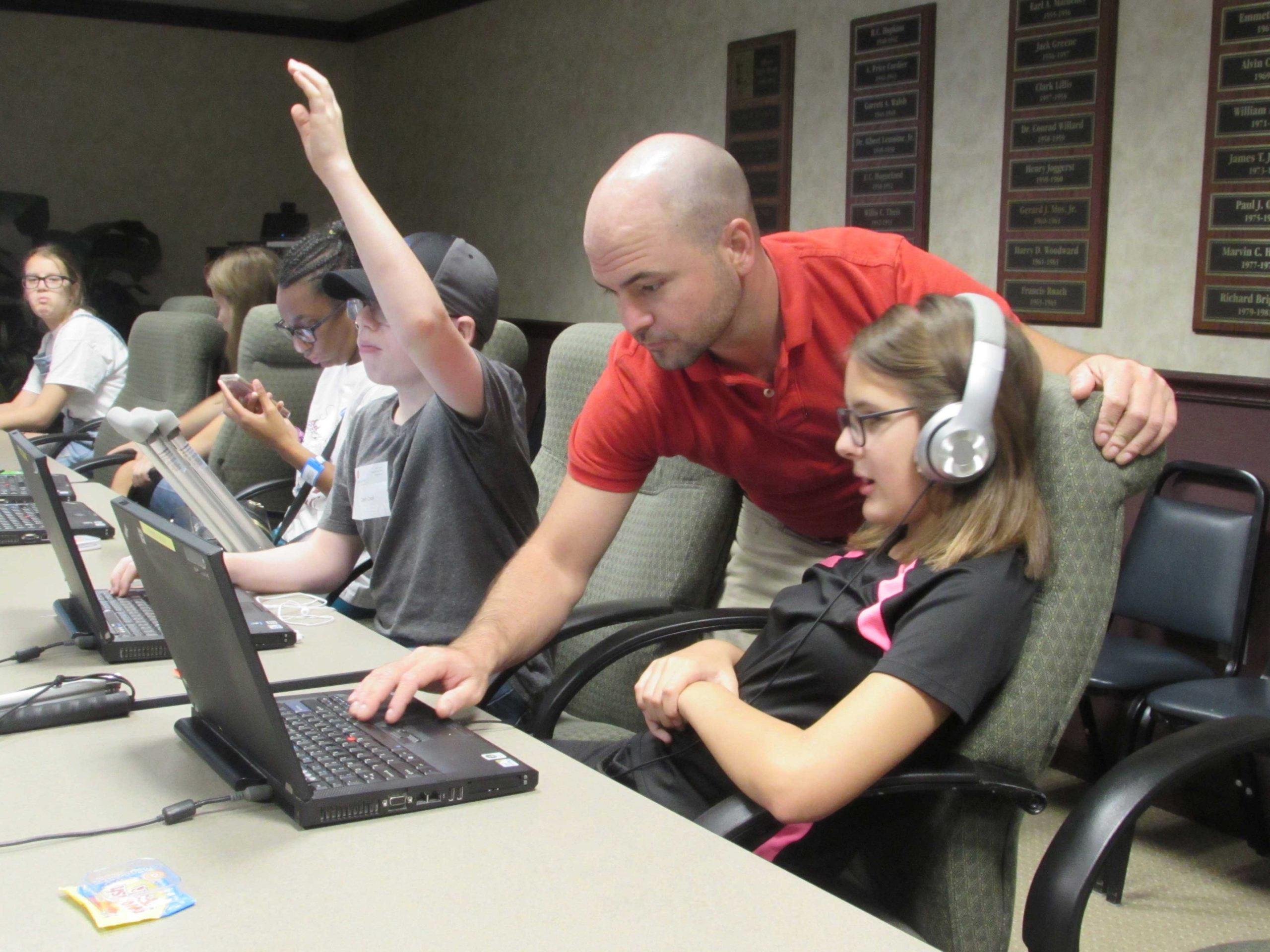 Students at the Alphapointe camp learning how to use their laptops